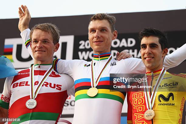 Silver medalist Vasil Kiryienka of Belarus, gold medalist Tony Martin of Germany and bronze medalist Jonathan Castroviejo Nicolas of Spain celebrate...