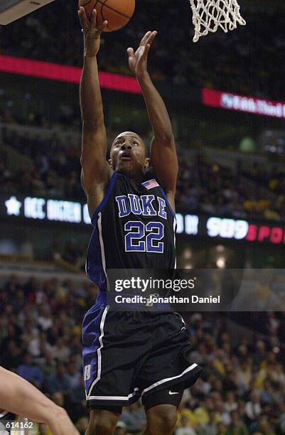 Jason Williams of the Duke Blue Devils puts up a shot during the ACC/Big Ten Challenge against the Iowa Hawkeyes at United Center in Chicago,...