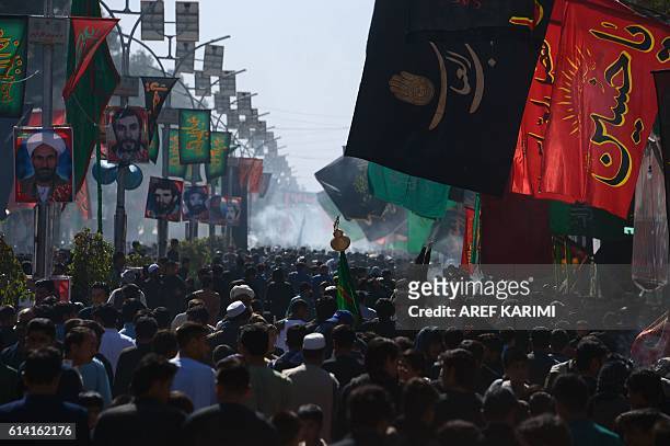 Afghan Shiite Muslims attend the ritual self-flagellation as part of Ashura commemorations in Herat on October 12, 2016. Ashura is a period of...