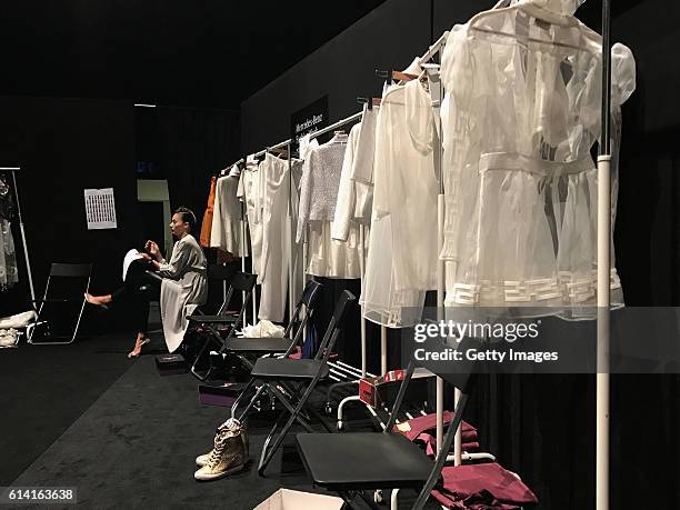 Model waiting backstage shot on a Apple iPhone 7 Plus during Mercedes-Benz Fashion Week Istanbul at Zorlu Center on October 11, 2016 in Istanbul,...
