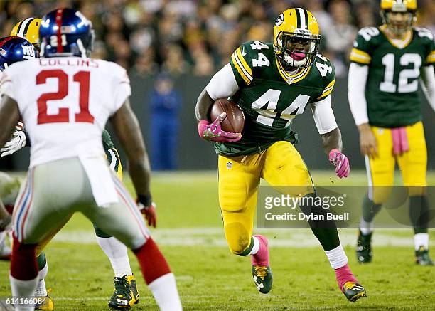 James Starks of the Green Bay Packers runs with the ball in the second quarter against the New York Giants at Lambeau Field on October 9, 2016 in...
