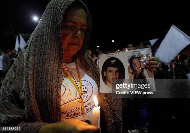 People take part in a march supporting the peace process on October 7, 2016 in Medellin, Colombia.