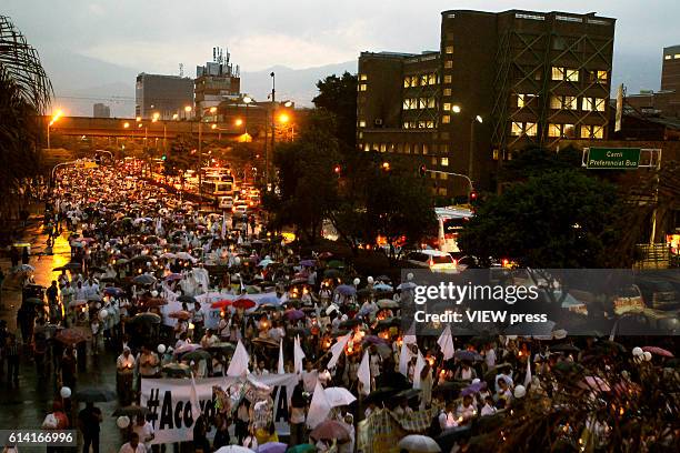 People take part in a march supporting the peace process on October 7, 2016 in Medellin, Colombia.