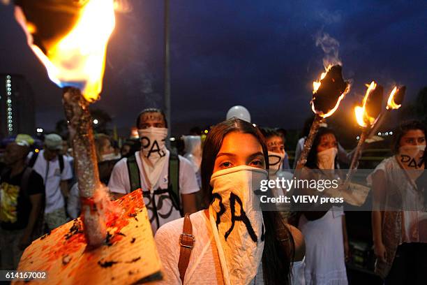 People take part in a march supporting the peace process on October 7, 2016 in Medellin, Colombia.