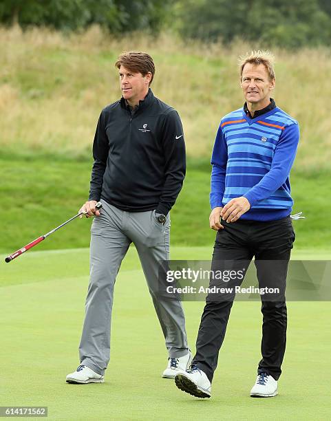 Ex-footballers Darren Anderton and Teddy Sheringham are pictured during the Pro Am prior to the start of the British Masters at The Grove on October...