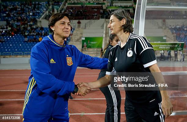 Head Coach Maria Is of Spain shake hands wit head coach Anouschka Bernhard of Germany prior to the FIFA U-17 Women's World Cup Quarter Final match...