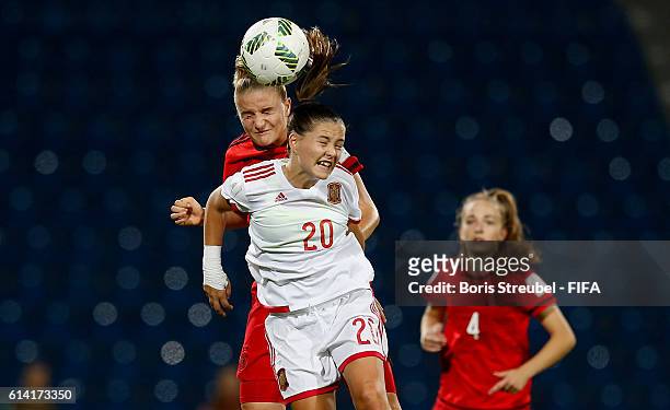 Lisa Schoeppl of Germany jumps for a header with Claudia Pina of Spain during the FIFA U-17 Women's World Cup Quarter Final match between Germany and...