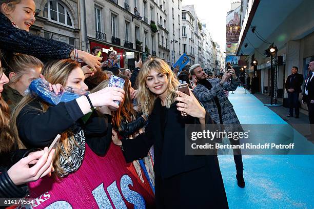 French voices of the movie, Louane Emera and Matt Pokora, signing autographs, attend "Les Trolls" Paris Premiere at Le Grand Rex on October 12, 2016...