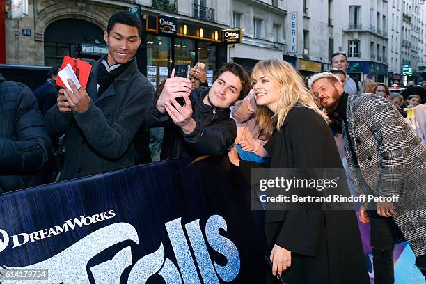 French voices of the movie, Louane Emera and Matt Pokora, signing autographs, attend "Les Trolls" Paris Premiere at Le Grand Rex on October 12, 2016...