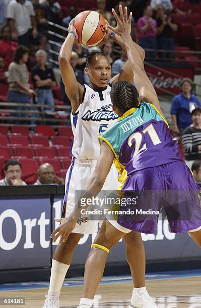 Elaine Powell of the Orlando Miracle faces up Tamecka Dixon of the Los Angeles Sparks during the WNBA game at TD Waterhouse Centre in Orlando,...