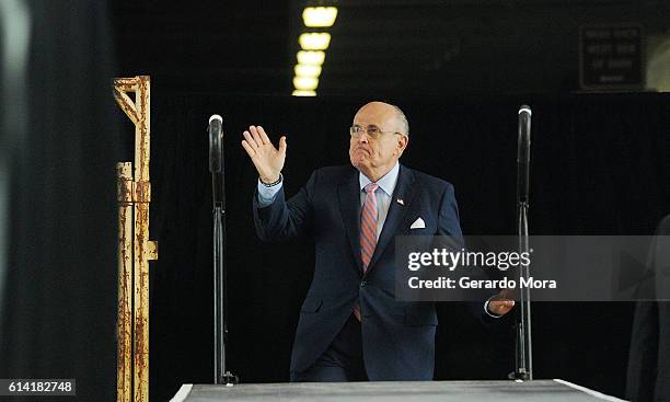 Former New York City mayor Rudy Giuliani arrives on stage during a campaign rally for Republican presidential nominee Donald Trump at Southeastern...