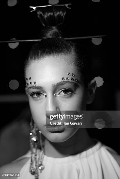 Model prepares backstage before the Selma State show during Mercedes-Benz Fashion Week Istanbul at Zorlu Center on October 12, 2016 in Istanbul,...