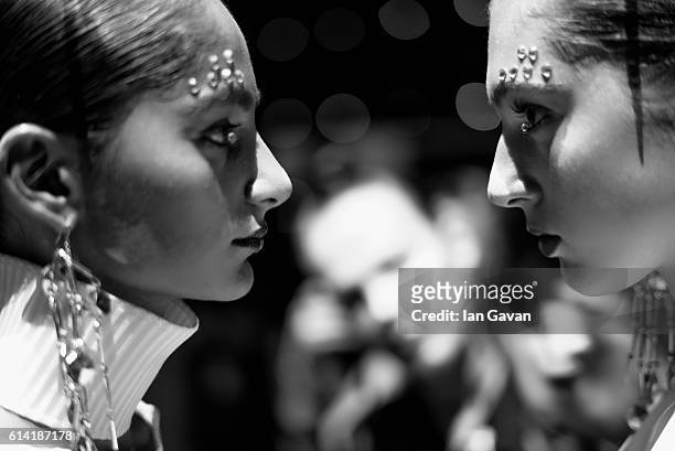 Model prepares backstage before the Selma State show during Mercedes-Benz Fashion Week Istanbul at Zorlu Center on October 12, 2016 in Istanbul,...