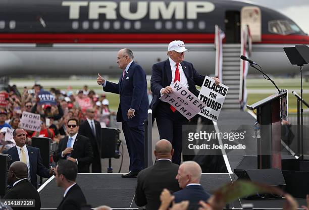 Republican presidential candidate Donald Trump and former New York City mayor Rudy Giuliani campaign together during a rally at the Lakeland Linder...