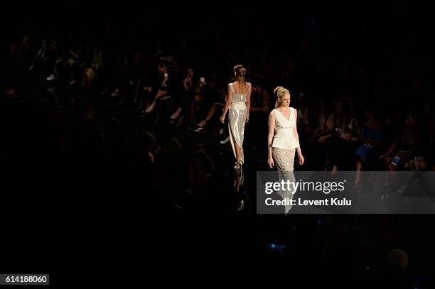 Models walks the runway at the Ozgur Masur show during Mercedes-Benz Fashion Week Istanbul at Zorlu Center on October 12, 2016 in Istanbul, Turkey.