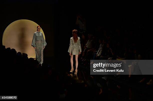 Models walks the runway at the Ozgur Masur show during Mercedes-Benz Fashion Week Istanbul at Zorlu Center on October 12, 2016 in Istanbul, Turkey.
