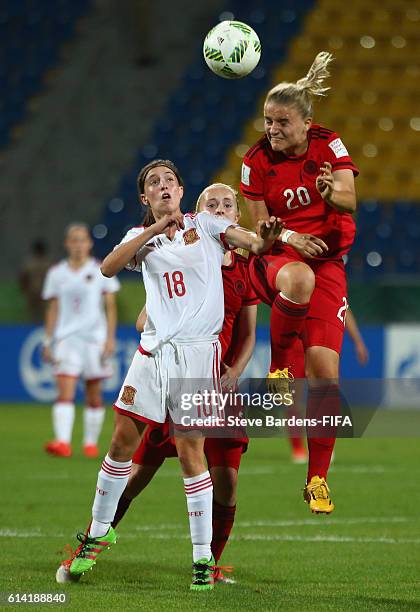 Lisa Schoeppl of Germany wins a header from Eva Navarro of Spain during the FIFA U-17 Women's World Cup Jordan 2016 quarter final match between...