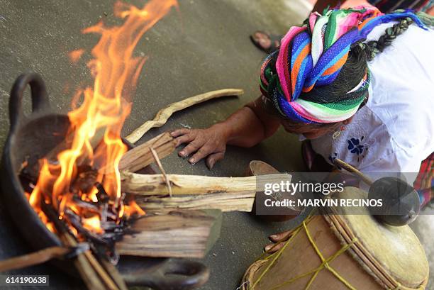Nahua Pipil indigenous woman participates in a ceremony commemorating the International Day of Indigenous Resistance at the San Andres Archeological...