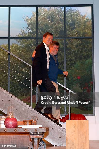 Actors Francis Huster and Regis Laspales acknowledge the applause of the audience at the end of the "A Droite A Gauche" : Theater Play at Theatre des...