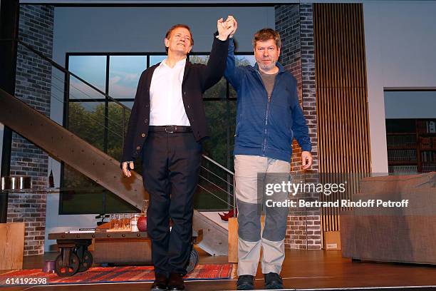 Actors Francis Huster and Regis Laspales acknowledge the applause of the audience at the end of the "A Droite A Gauche" : Theater Play at Theatre des...