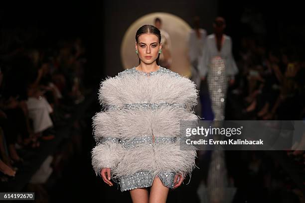 Model walks the runway at the Ozgur Masur show during Mercedes-Benz Fashion Week Istanbul at Zorlu Center on October 12, 2016 in Istanbul, Turkey.