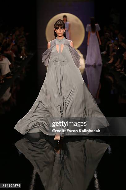 Model walks the runway at the Ozgur Masur show during Mercedes-Benz Fashion Week Istanbul at Zorlu Center on October 12, 2016 in Istanbul, Turkey.