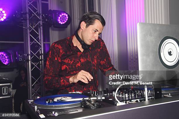 Mark Ronson DJs at the launch of the Esquire Townhouse with Dior on October 12, 2016 in London, England.