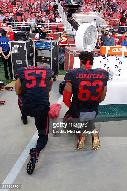 Michael Wilhoite and Tony Jerod-Eddie of the San Francisco 49ers say a prayer on the sideline prior to the game against the Arizona Cardinals at Levi...
