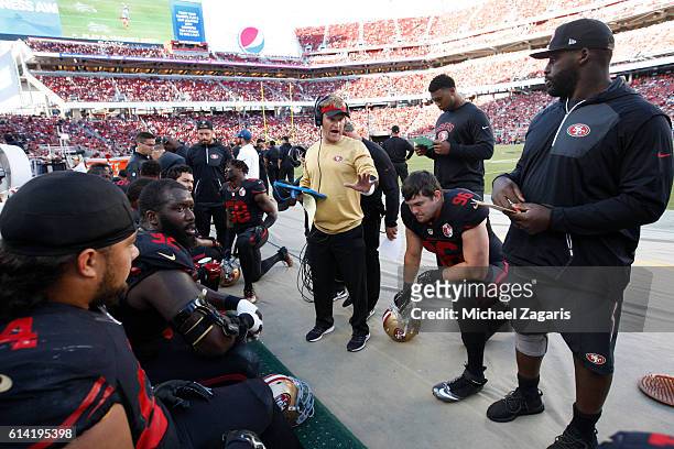 Outside Linebackers Coach Jason Tarver of the San Francisco 49ers talks with the defensive line during the game against the Arizona Cardinals at Levi...