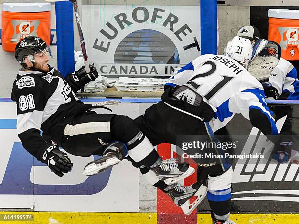Mathieu Joseph of the Saint John Sea Dogs checks Jeremy Roy of the Blainville-Boisbriand Armada during the QMJHL game at the Centre d'Excellence...