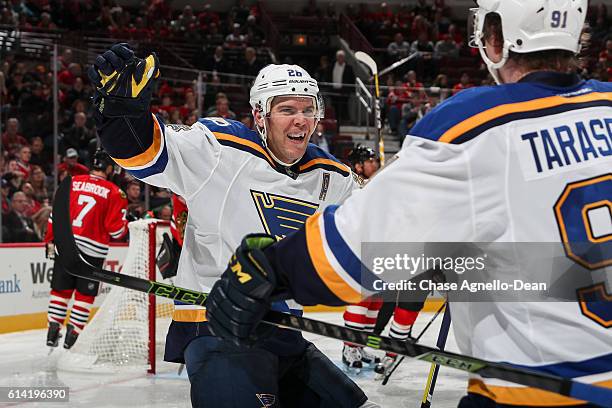 Paul Stastny of the St. Louis Blues reacts after scoring against the Chicago Blackhawks in the third period during the season opener at the United...