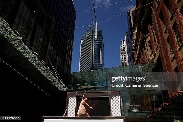 Model and dancer Mimi Elashiry performs on top of the world's first life-size jewellery box in Pitt Street Mall on October 13, 2016 in Sydney,...