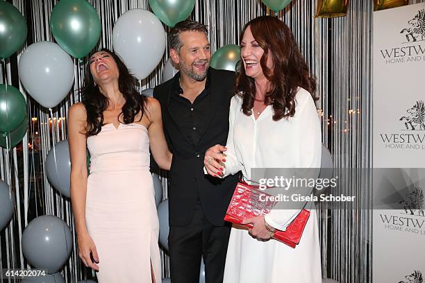 Bettina Zimmermann and her partner Kai Wiesinger and Natalia Woerner during the 5th anniversary of Westwing on October 12, 2016 in Munich, Germany.