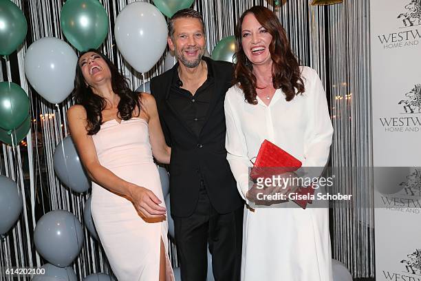 Bettina Zimmermann and her partner Kai Wiesinger and Natalia Woerner during the 5th anniversary of Westwing on October 12, 2016 in Munich, Germany.