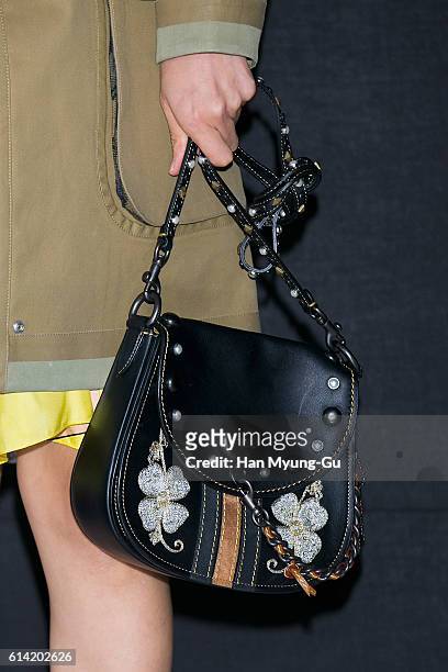 South Korean actress Kim Na-Young, bag detail, attends the photocall for "COACH" 75th Anniversary on October 12, 2016 in Seoul, South Korea.