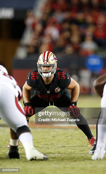 Nick Bellore of the San Francisco 49ers eyes th quarterback during the game against the Arizona Cardinals at Levi Stadium on October 6, 2016 in Santa...