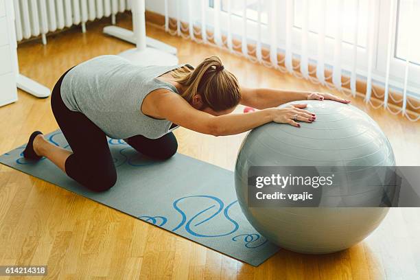 pregnant woman exercising pilates. - yoga ball stock pictures, royalty-free photos & images