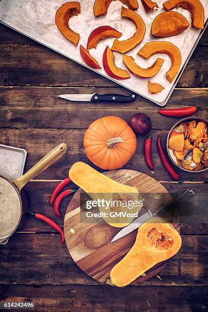 preparing and baking fresh pumpkins - hokaido pumpkin stock pictures, royalty-free photos & images