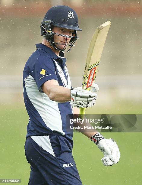 Cameron White of the Bushrangers celebrates and acknowledges the crowd after scoring a century during the Matador BBQs One Day Cup match between...