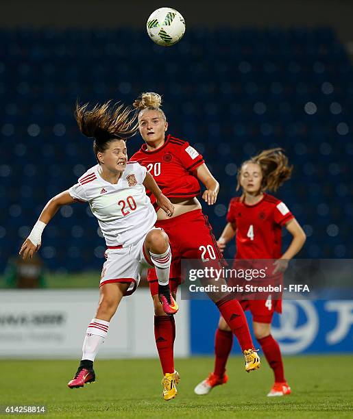 Lisa Schoeppl of Germany jumps for a header with Claudia Pina of Spain during the FIFA U-17 Women's World Cup Quarter Final match between Germany and...