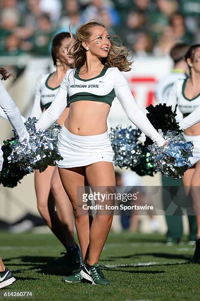 Spartans dance team member performs during a non-conference NCAA football game between Michigan State and BYU at Spartan Stadium, East Lansing, MI.