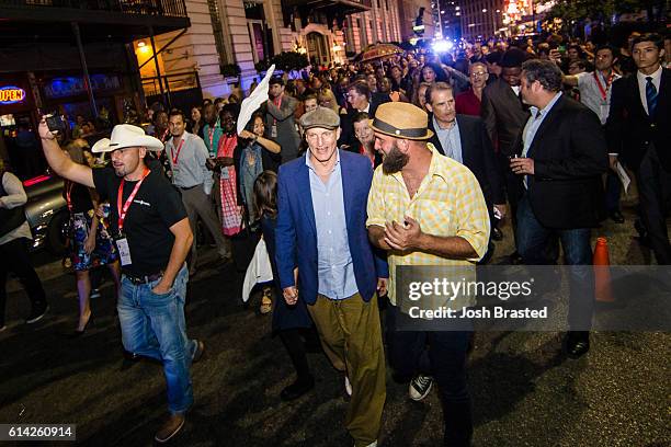 Woody Harrelson participates in a second line parade following the New Orleans premiere of 'LBJ' at The Orpheum Theatre on October 12, 2016 in New...