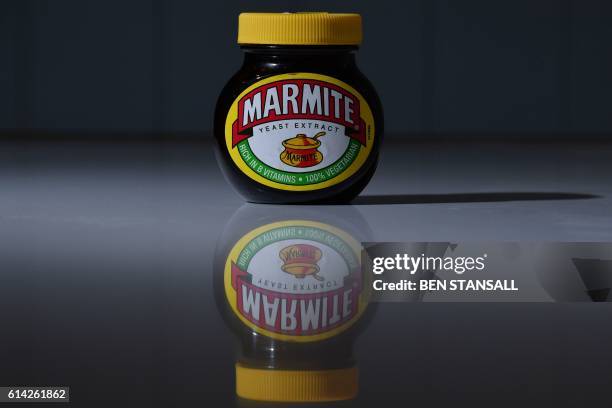 Jar of Marmite, produced by Unilever, is arranged for a photogaph in Brenchley, south east England, on October 13, 2016. - British staple Marmite was...