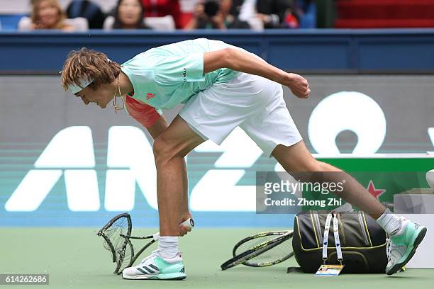 Alexander Zverev of Germany reacts by crashing his racquet the match against Jo-Wilfried Tsonga of France on Day 5 of the ATP Shanghai Rolex Masters...