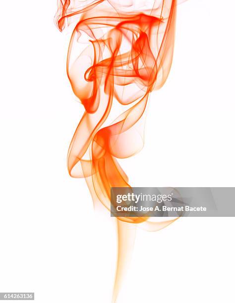 figures and forms of orange smoke in movement on a white bottom - wispy stock pictures, royalty-free photos & images