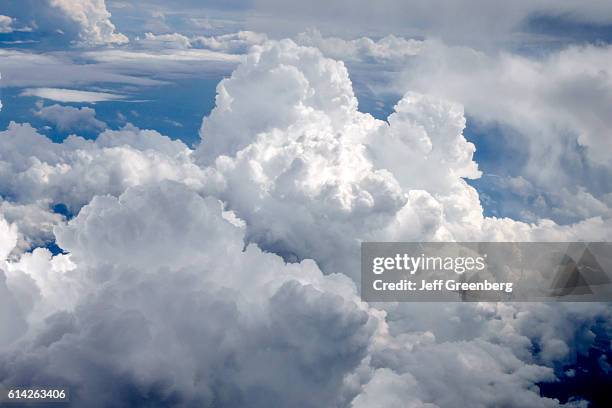 Lambert-St. Louis International Airport, cloudy sky view from airplane window seat.
