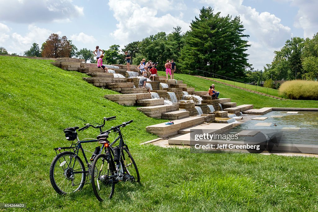 People climbing Government Hill fountain in Forest Park.