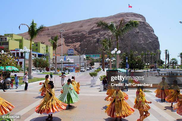 Women dancing the Caporales traditonal dance at the Andean Carnival parade rehearsal.