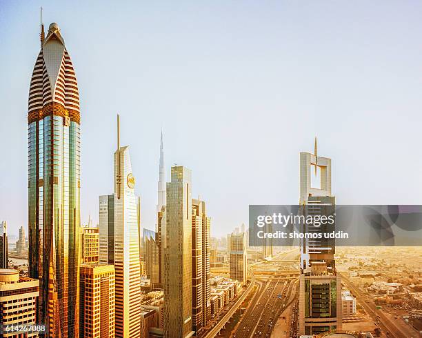 aerial view over dubai city skyline - arial view dubai skyline stock pictures, royalty-free photos & images