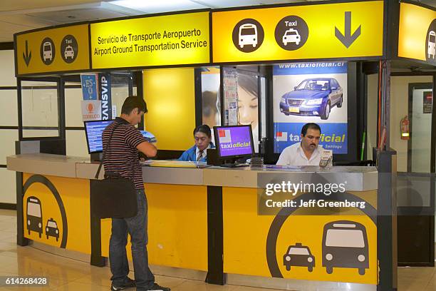 Comodoro Arturo Merino BenÕtez International Airport, ground transportation sign.